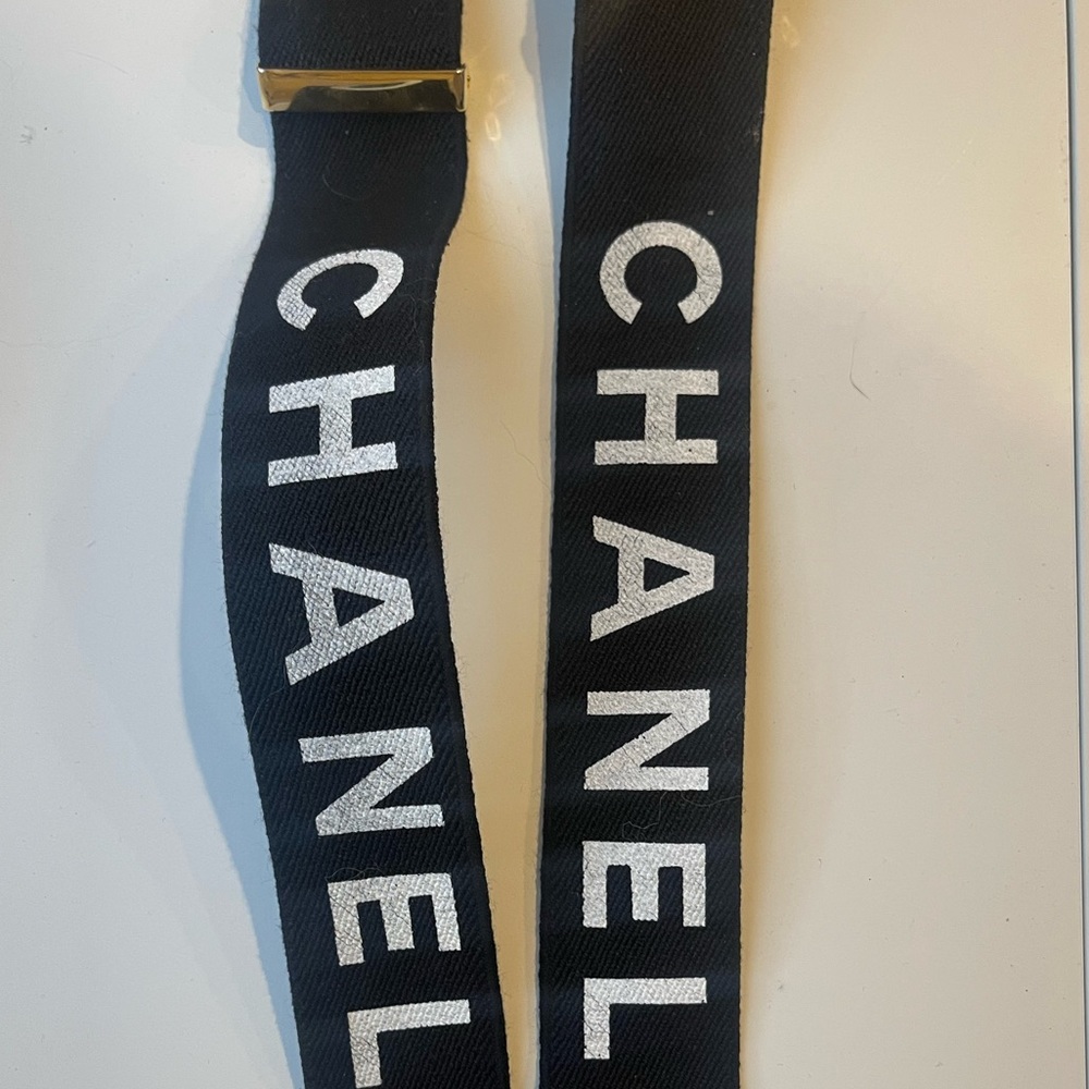 Authentic Chanel suspenders in black and gold. 1990-2000 logo suspenders